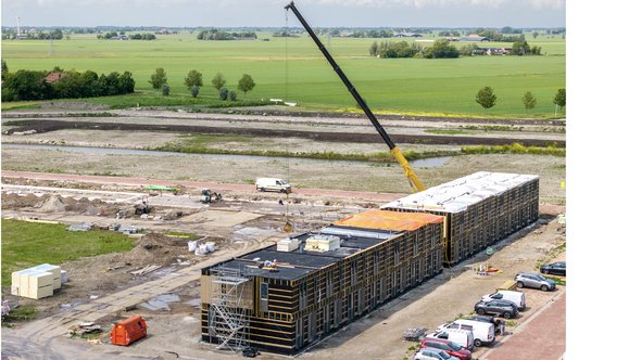 Modular housing under construction door Thomas Roell (bron: Shutterstock)